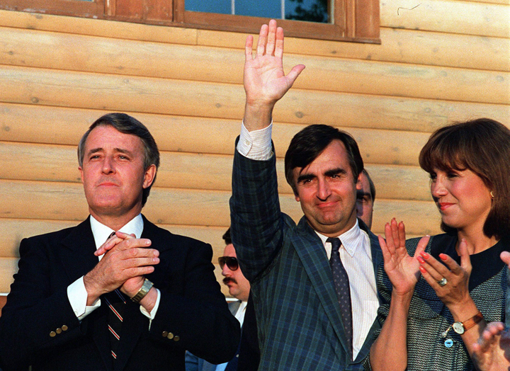 Prime Minister Brian Mulroney and Wife Mila applaud to encourage Lac St. Jean Tory candidate Lucien Bouchard at a campaign meeting in Chicoutimi on June 12, 1988.