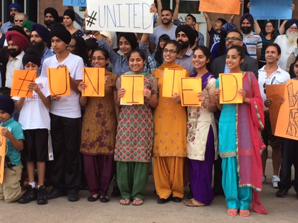 Residents in Brampton hold a rally against anti-immigration flyers that have been circulating.