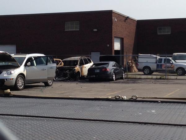 Police continue to investigate after several cars were torched in a used lot in North York on Aug. 11, 2014.