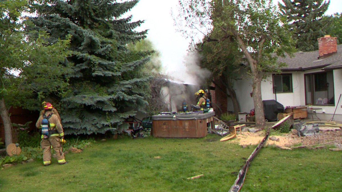 Calgary fire crews battle a garage fire, Sunday, August 24, 2014. 
