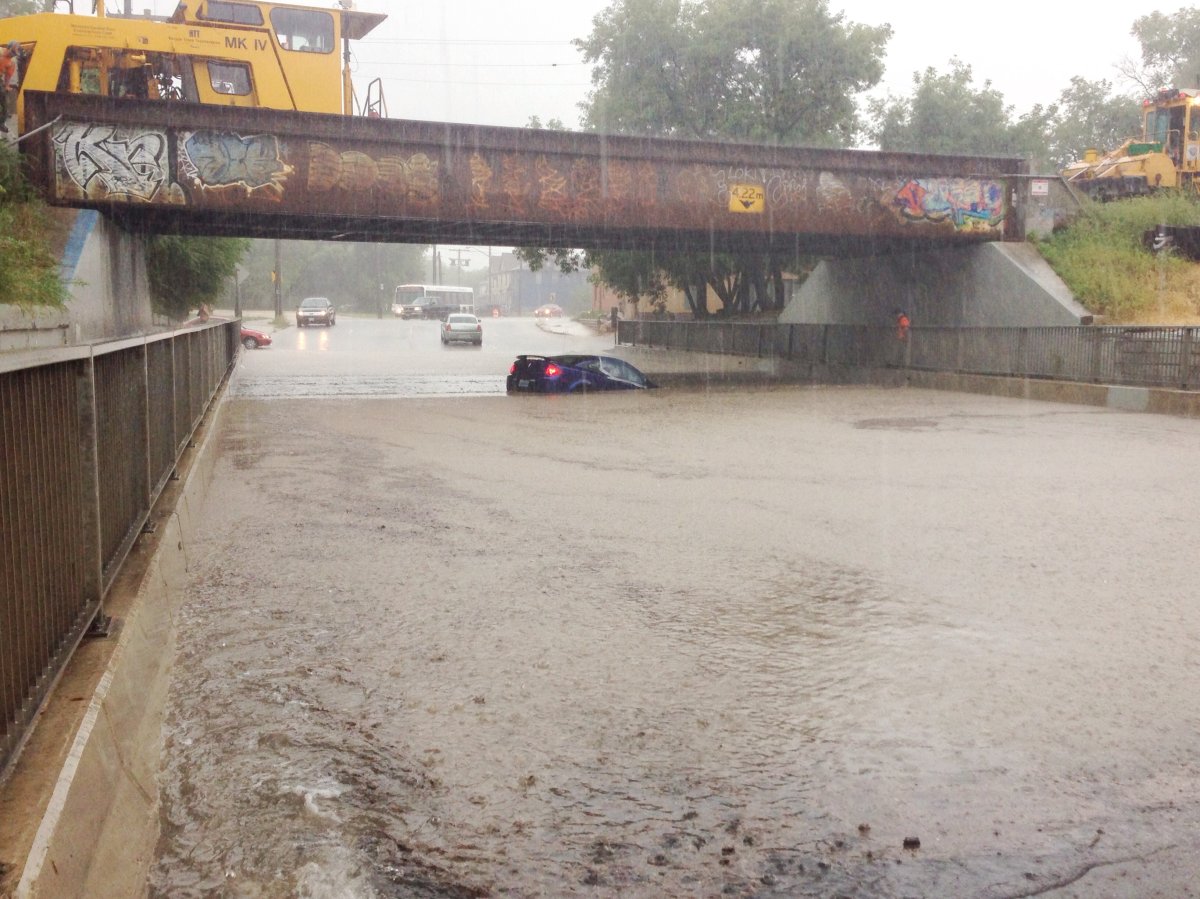A car is submerged in water at an underpass in Winnipeg.