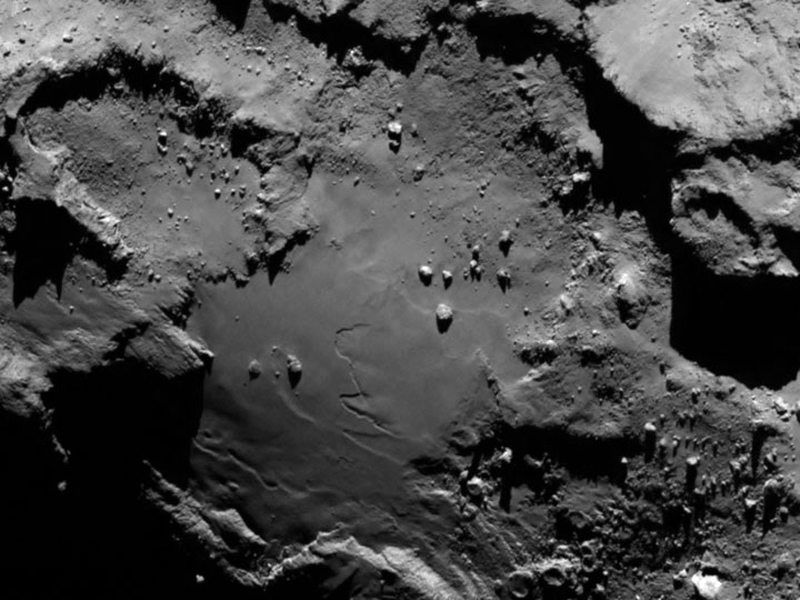Stunning close up detail focusing on a smooth region on the ‘base’ of the ‘body’ section of comet 67P/Churyumov-Gerasimenko.