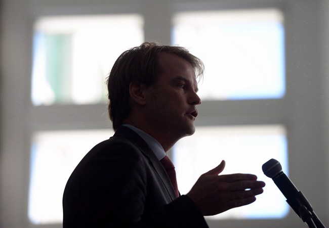 Immigration Minister Chris Alexander speaks during an event in Ottawa on June 20, 2014. Activists and legal experts say Canada's refugee policy regularly threatens to break up families and often fails to take into consideration the interests of the children involved.