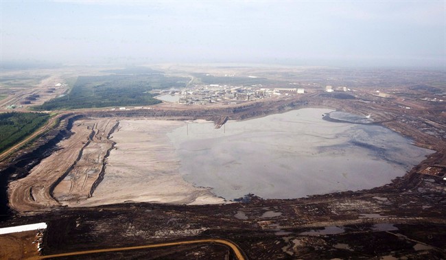 A tailings pond at the Syncrude oilsands facility is seen from a helicopter near Fort McMurray, Alta., July 10, 2012.