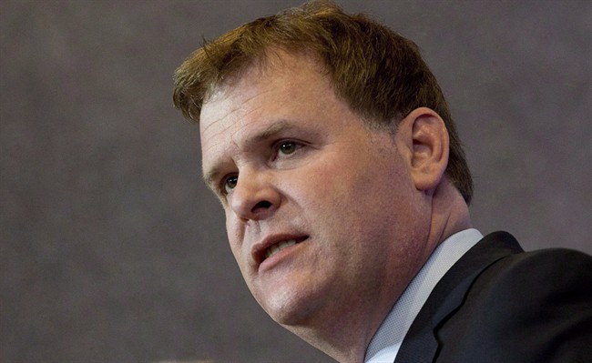 Foreign Affairs Minister John Baird responds to a question at a news conference Friday, May 2, 2014 in Ottawa. 