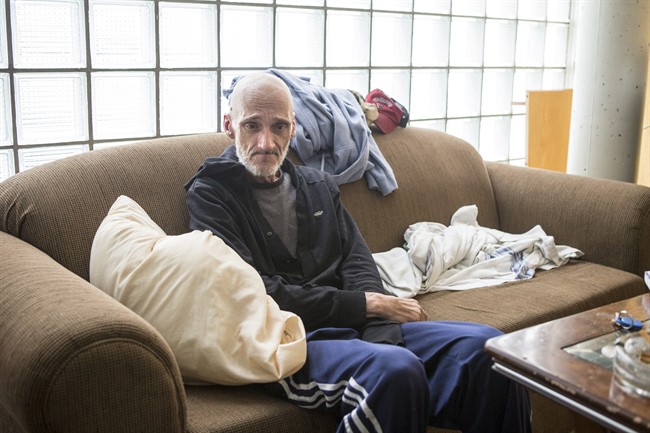 Dan Thibideau sits in his room at Toronto's Fred Victor transitional housing centre on Wednesday, July 30 , 2014. Thibideau, who has cancer, is the first patient of the PEACH (Palliative Education and Care for the Homeless) program.