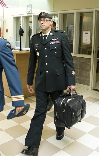 Warrant officer Andre Gagnon walks to testify at his court martial at the St-Malo Armoury Tuesday, August 12, 2014 in Quebec City. 