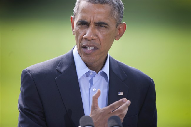 President Barack Obama speaks on the South Lawn of the White House in Washington, Saturday, Aug. 9, 2014, about the ongoing situation in Iraq before his departure on Marine One for a vacation in Martha’s Vineyard. 
