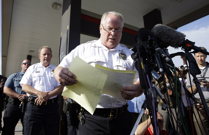 Ferguson Police Chief Thomas Jackson releases the name of the the officer accused of fatally shooting an unarmed black teenager Friday, Aug. 15, 2014, in Ferguson, Mo. Jackson announced that the officer's name is Darren Wilson. 