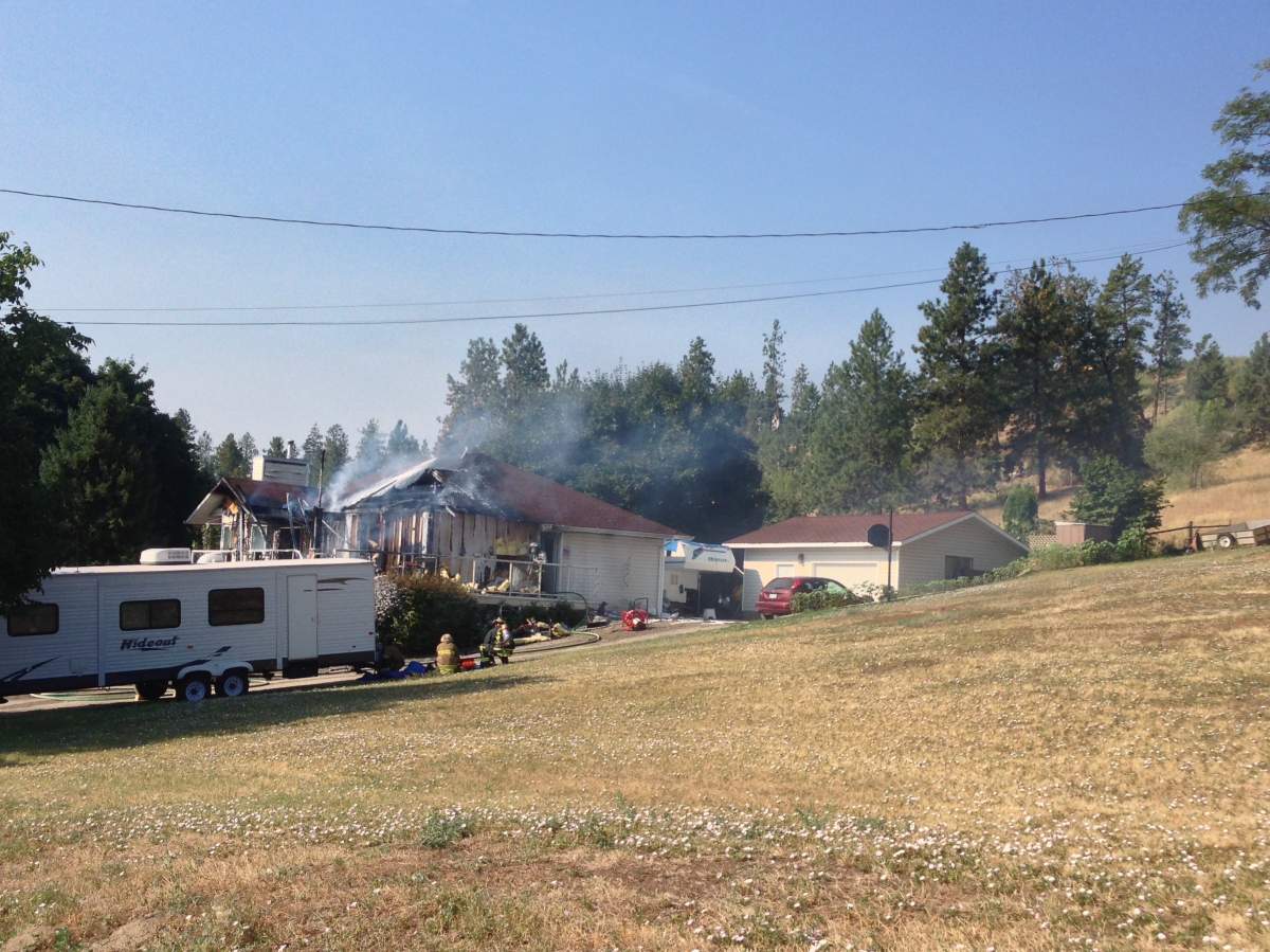 Three men rescue West Kelowna woman from burning home - image