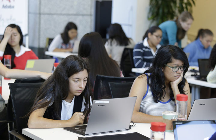 Bryanna Gilges, 15, left, and Yvonne Gonzalez, 17, right, work at completing an exercise during a Girls Who Code class at Adobe Systems in San Jose, Calif. The program aims to inspire and equip young women for futures in the computing-related fields.