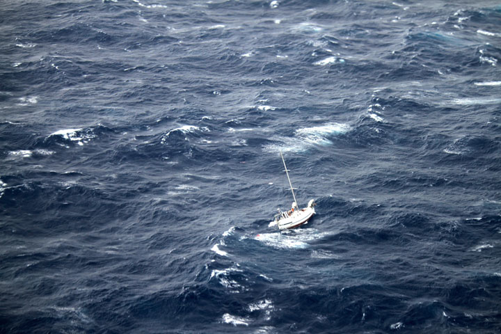 This Sunday, Aug. 10, 2014 photo provided by the U.S. Coast Guard shows the 42-foot sailboat Walkabout caught in Hurricane Julio, about 400 miles northeast of Oahu, Hawaii.