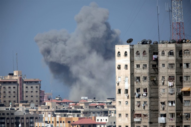 Smoke rises over Gaza City after an Israeli strike, Friday, Aug. 8, 2014, as Israel and Gaza militants resumed cross-border attacks after a three-day truce expired and Egyptian-brokered talks on a new border deal for blockaded Gaza hit a deadlock.
