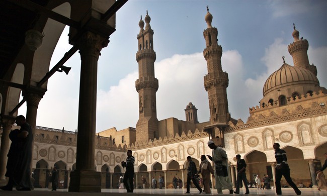In this Friday, Dec. 28, 2012 file photo, Muslims arrive to attend the Friday prayer at Al-Azhar mosque in Cairo, Egypt. 