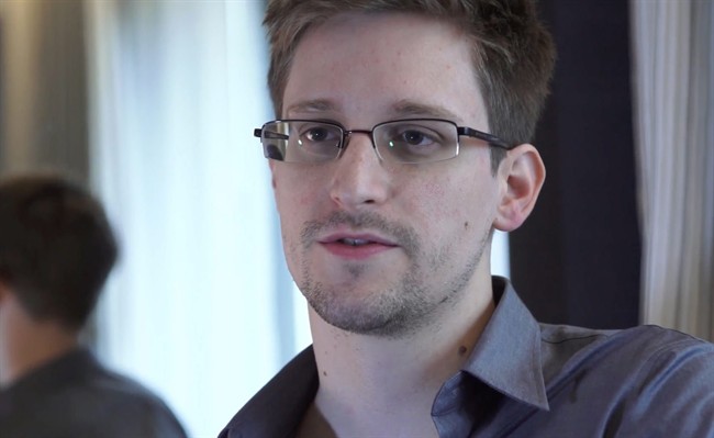 In this June 9, 2013 file photo provided by The Guardian Newspaper in London shows Edward Snowden, who worked as a contract employee at the National Security Agency, in Hong Kong. 
