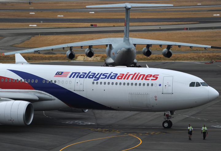 A Malaysia Airlines plane prepares to go onto the runway at Perth International Airport on March 25, 2014. 