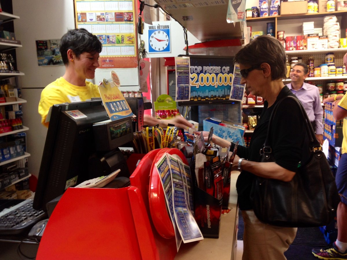 MP Megan Leslie rings through customer purchases at a Halifax-area convenience store.