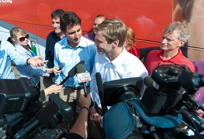 New Brunswick Liberal Leader Brian Gallant, centre right, and Federal Liberal Leader Justin Trudeau speak with the media in Moncton on Aug. 23, 2014. 