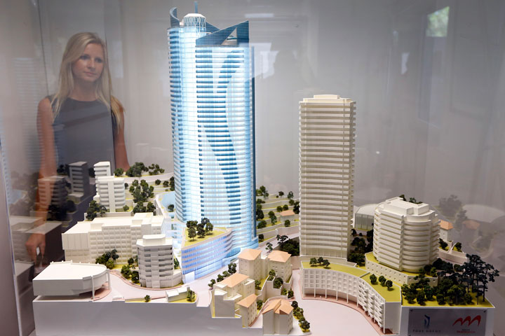 A women looks at the Odeon Tower model on August 22, 2013, in Monaco.