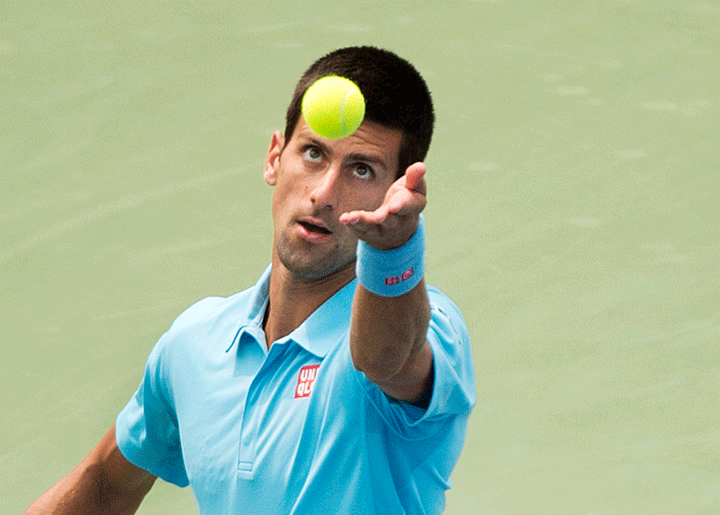 Novak Djokovic of Serbia serves the ball against Jo-Wilfried Tsonga of France during men's third round Rogers Cup tennis action in Toronto on Thursday, August 7, 2014. 