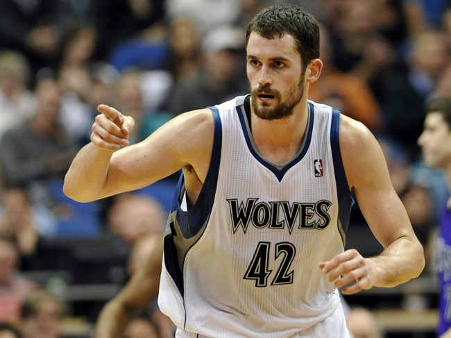 In this Jan. 16, 2012, file photo, Minnesota Timberwolves' Kevin Love reacts during the second half of an NBA basketball game against the Sacramento Kings in Minneapolis.