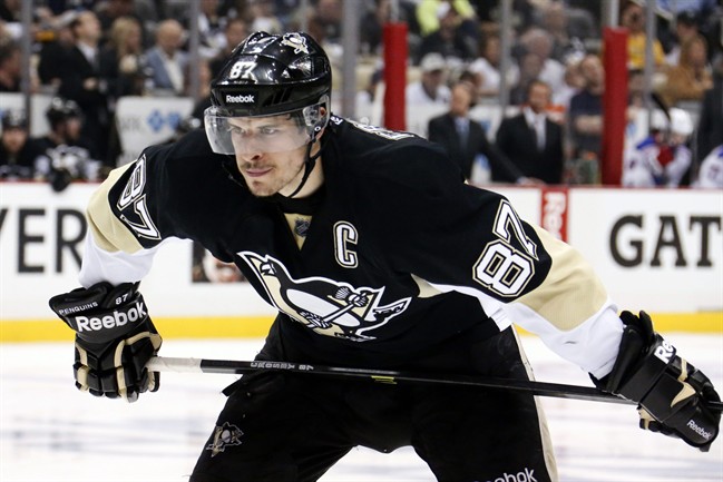 In this May 13, 2014, file photo, Pittsburgh Penguins' Sidney Crosby prepares to take a face off in the second period of Game 7 of a second-round NHL playoff hockey series against the New York Rangers in Pittsburgh.