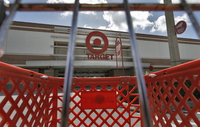 FILE - This Monday, Aug. 19, 2013 file photo shows a shopping cart outside a Target store in Riverview, Fla. Target Corp. reports quarterly earnings on Wednesday, Aug. 20, 2014. (AP Photo/Chris O'Meara, File)