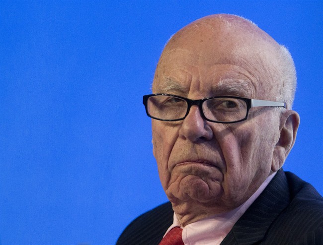 FILE - In this July 17, 2014 photo, Rupert Murdoch, executive chairman of News Corporation, listens to a question during a panel discussion at the B20 meeting of company CEOs in Sydney, Australia. Murdoch’s 21st Century Fox on Tuesday, Aug. 5, 2014 said it is abandoning its attempt to take over Time Warner in a proposed deal that would have combined two of the world’s biggest media companies.