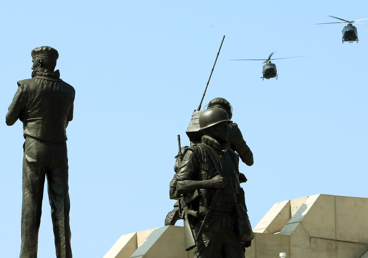 Two Canadian military helicopters fly over the National Peacekeepers Day Ceremony at the Peacekeeping Monument in Ottawa, August 10, 2014.