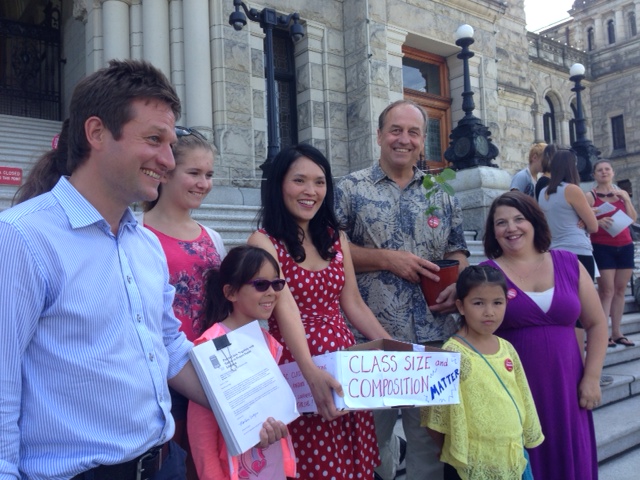 Politicians, parents and teachers at the Legislature handing in the petition signed by more than 11,000 people.