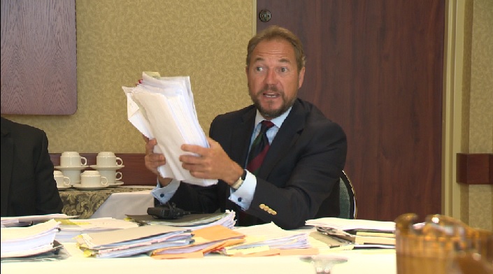 PHA Operations Director holds onto some of the paperwork the association has accumulated over the legal battle against the City of Penticton.