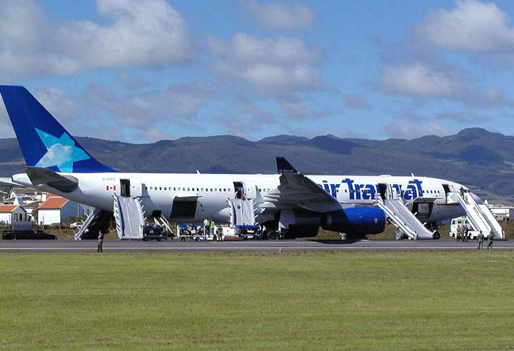 A Canadian Air Transat plane lies on the tarmac of the Lajes airport in the Azores Terceira island after an emergency landing, Friday, Aug. 24 2001, in the north Atlantic Portuguese archipelago. 
