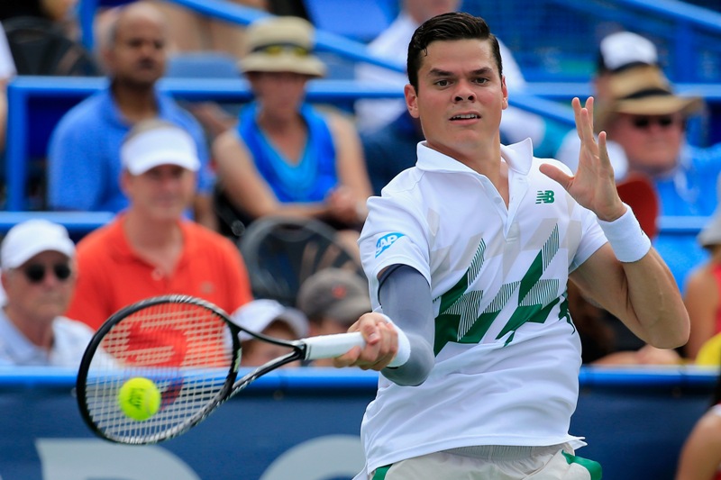 Milos Raonic, of Canada, returns a ball against Donald Young during a match at the Citi Open tennis tournament, Saturday, Aug. 2, 2014, in Washington. (AP Photo/Nick Wass).