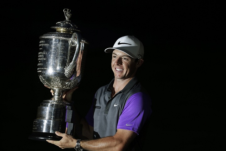Rory McIlroy, of Northern Ireland, holds up the Wanamaker Trophy after winning the PGA Championship golf tournament at Valhalla Golf Club on Sunday, Aug. 10, 2014, in Louisville, Ky. 