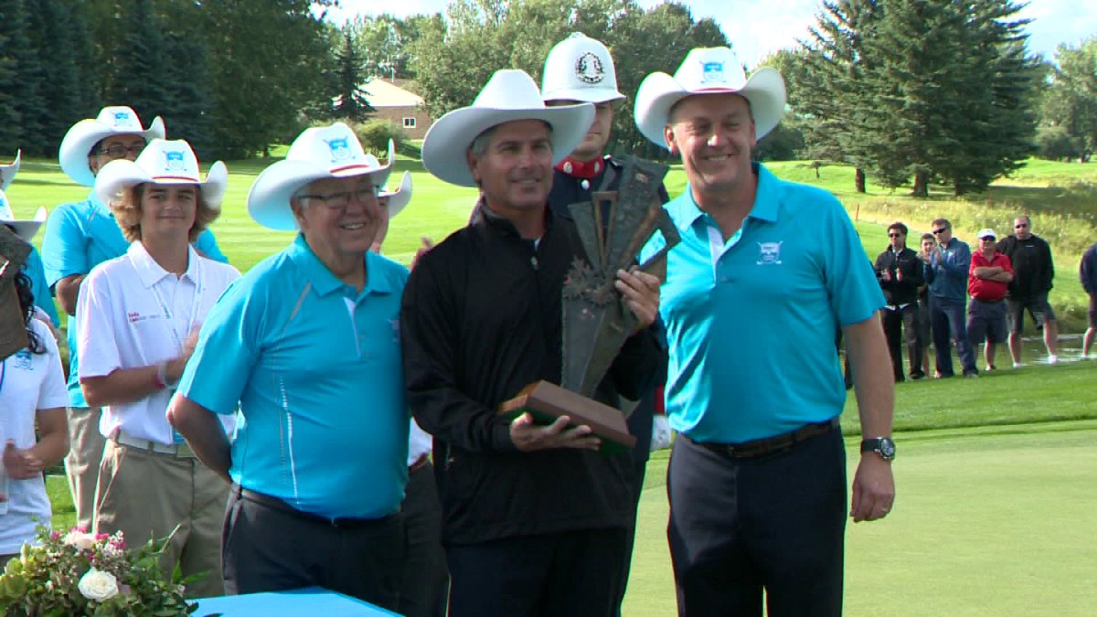Fred Couples accepting his trophy at the Shaw Charity Classic in 2014.