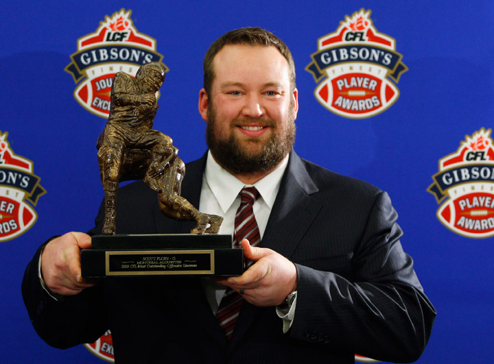 Scott Flory, of the Montreal Alouettes, holds his trophy for the CFL Most Outstanding Lineman during the 2009 Gibson's Finest Players Awards on Thursday, Nov. 26, 2009 in Calgary, Alta.