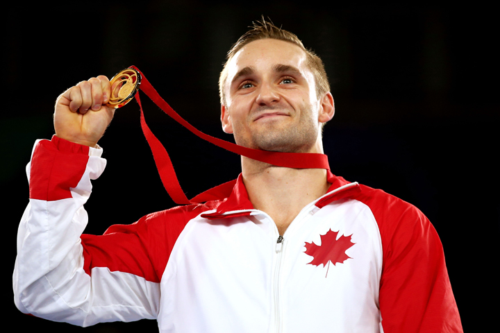 Gold medalist Scott Morgan of Canada poses during the medal ceremony for the Men's Vault Final at SSE Hydro during Day 9 of the Glasgow 2014 Commonwealth Games on August 1, 2014 in Scotland.  