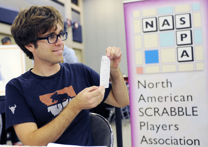 Conrad Bassett-Bouchard poses with his scorecard after he won the title at the National Scrabble Championships, Wednesday, Aug. 13, 2014, in Buffalo, N.Y. 