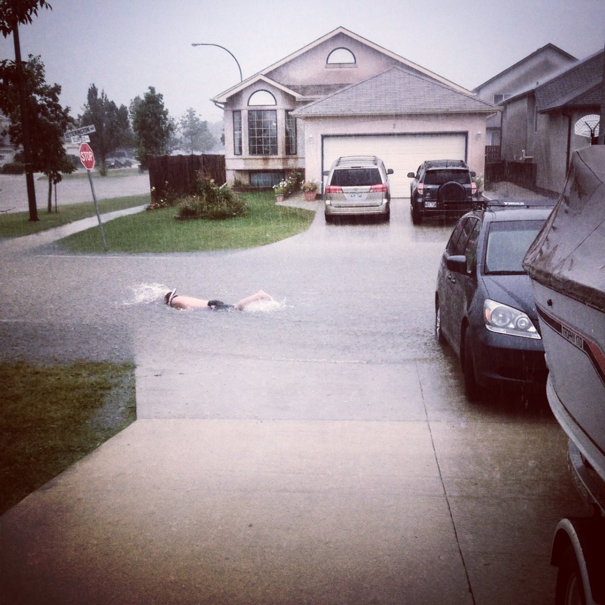 A Winnipeg man snorkels through the streets in Whyte Ridge. August 21, 2014.