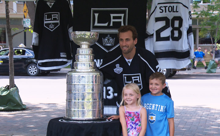 Los Angeles Kings’ Jarret Stoll seen posing with hockey fans and the Stanley Cup in Saskatoon.