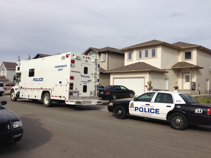 Edmonton police investigate after a female was found dead in a home in the area of 37 Avenue and 13 Street Friday, August 29, 2014.