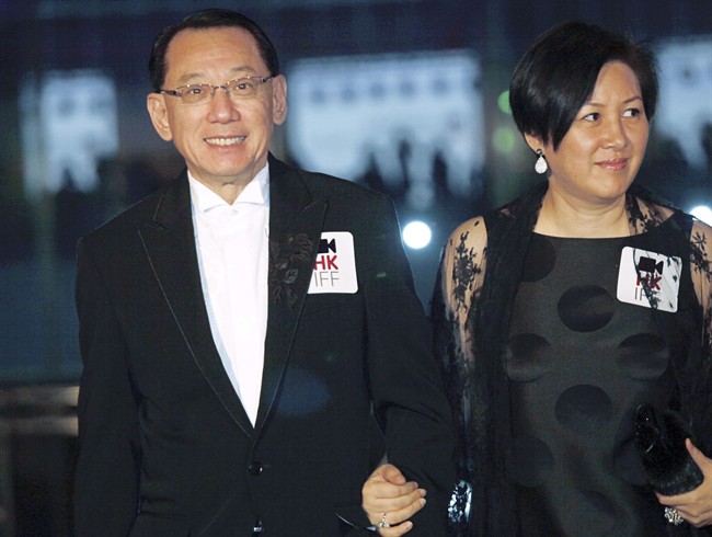 Albert Yeung, left, chairman of the Hong Kong media conglomerate Emperor Entertainment Group and his wife attend the premiere of his film " Shinjuku Incident.".