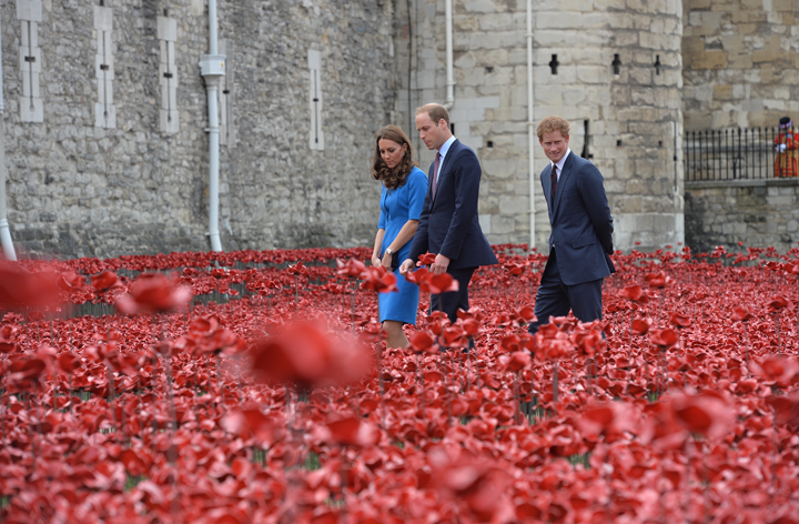 Catherine, The Duchess of Cambridge, Prince William, Duke of Cambridge and Prince Harry visit The Tower of London's 'Blood Swept Lands and Seas of Red' ceramic poppy installation by artist Paul Cummins, commemorating the 100th anniversary of the outbreak of First World War on August 5, 2014 in London, England.