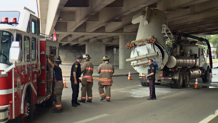 Six drivers ticketed for snapping pictures of a truck that hit an overpass Tuesday in Saskatoon.