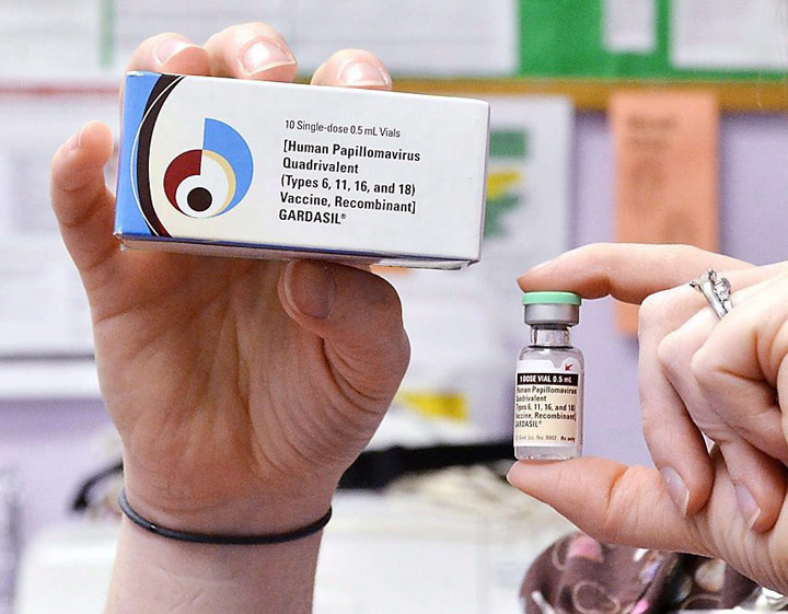 A child health nurse holds up a vial and box for the HPV vaccine, brand name Gardasil, at a clinic in Kinston, N.C. in a March 5, 2012 file photo.
