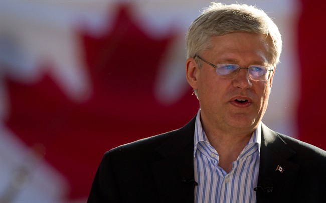 Prime Minister Stephen Harper addresses supporters during a party gathering at Krause Berry Farms in Langley, B.C., on Wednesday August 20, 2014.