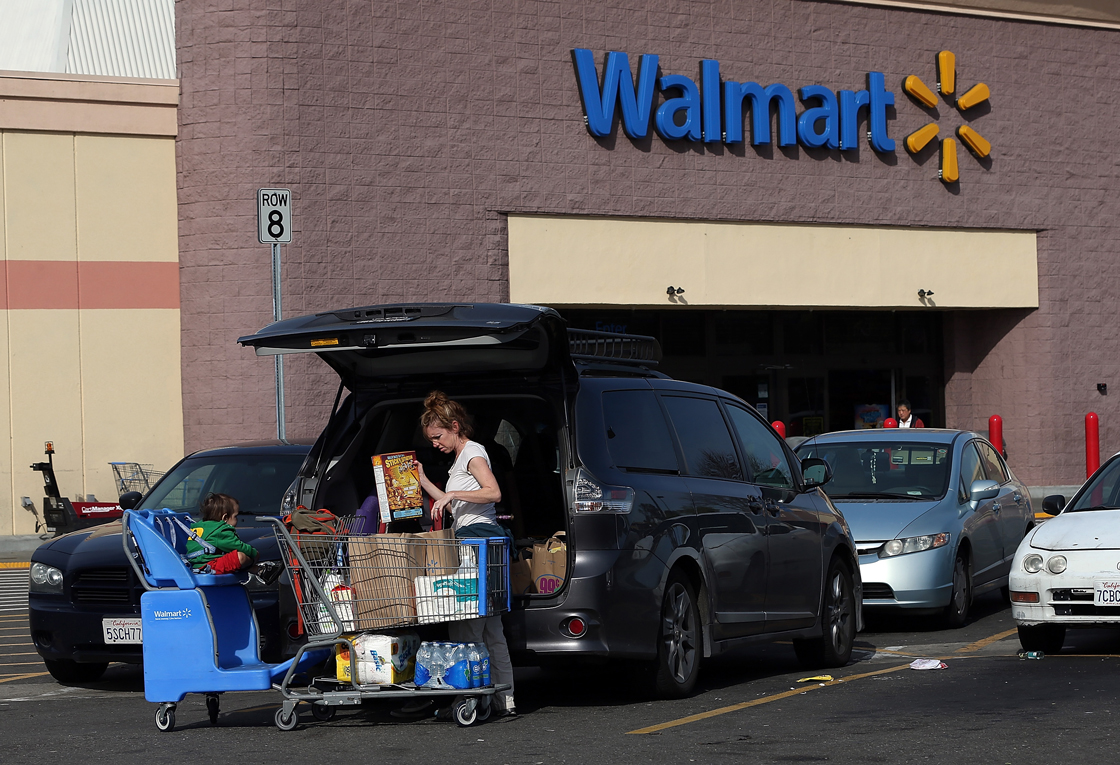 The number of consumers walking through Walmart's doors is growing, but barely. It appears growth instead is coming from existing shoppers spending more.