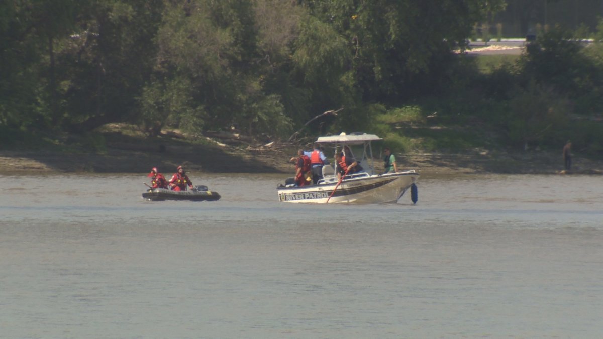 Police and fire crews search the Red River for someone in distress. Aug 15, 2014.