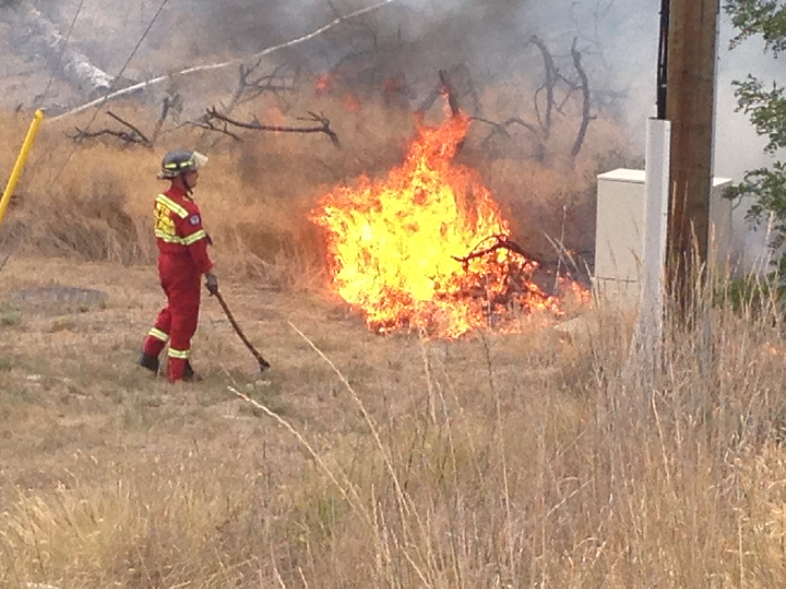 A grass fire broke out in West Kelowna on August 25, 2014.