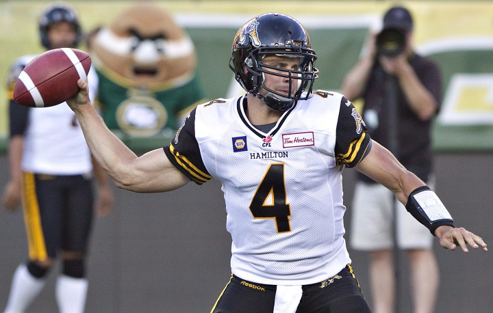 Hamilton Tiger-Cats quarterback Zach Collaros (4) makes the throw against the Edmonton Eskimos during first half action in Edmonton on July 4, 2014. Collaros will get the start at quarterback Monday afternoon when the Hamilton Tiger-Cats host the Toronto Arogonauts in the first game at new Tim Hortons Field. Collaros returns after missing the last four games with a concussion suffered in a 28-24 loss to the Edmonton Eskimos on July 4.